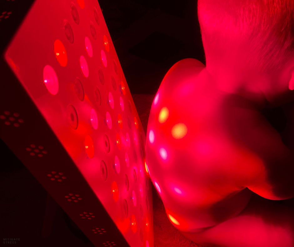 Child in front of red light panel